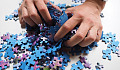 &nbsp;Hands mixing up all the pieces of a puzzle. Image by Hans from Pixabay.&nbsp;